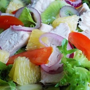 Delicious and satisfying cocktail salad with chicken and fruit